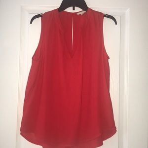 Sleeveless red blouse
